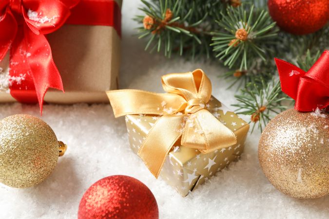 Gift boxes with bow on decorated background, close up