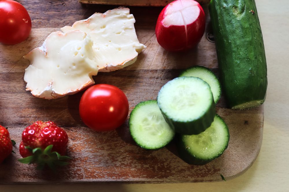 Close view on a healthy german breakfast with sandwiches, tomatoes and cucumbers