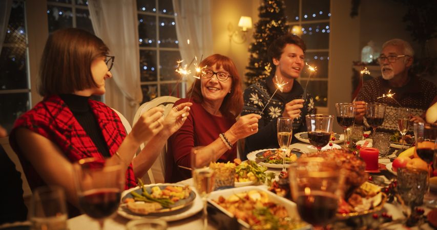 Family and Friends Gather at Home for a Traditional Christmas Dinner with a Turkey Roast Feast.