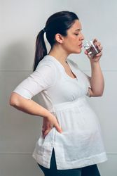 Pregnant woman drinking water