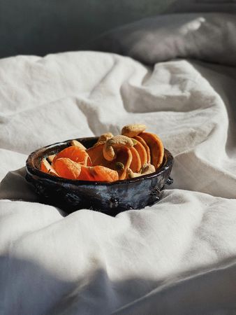 Bowl of orange slices for breakfast in bed