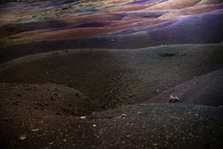 Multi-colored hill in Mauritius under clouds