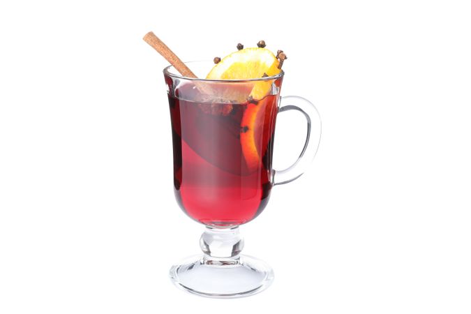 Glass of tasty mulled wine with lemon isolated on plain background