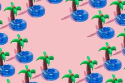 Tropical palm inflatable toy pattern on pink background