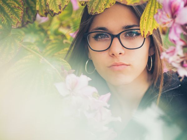 Portrait of woman among blooming trees