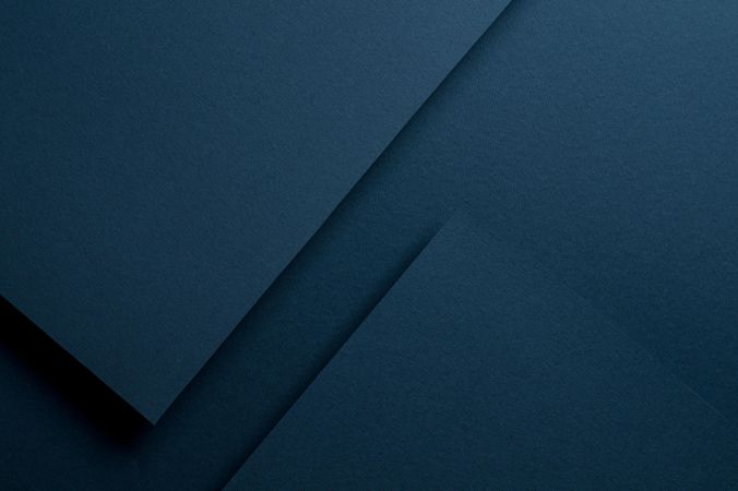 Dark blue paper casting shadows