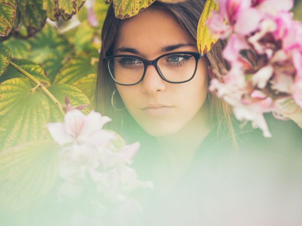 Portrait of woman among blooming trees