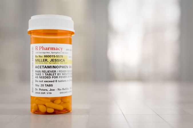 Acetaminophen Prescription Medicine Bottle Resting On A Bathroom Countertop.