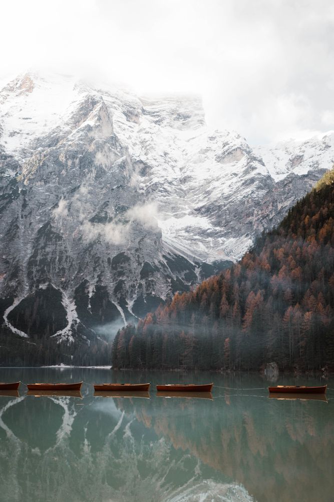 Beautiful lake with boast with mountains behind