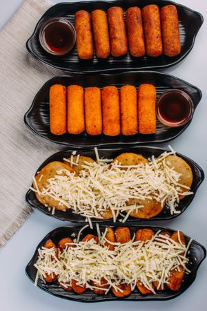 Combinations of Venezuelan dishes, served as starters, tequeños, sweet arepas with cheese and fried plantain with cheese