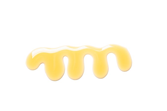 Sweet honey smear isolated on neutral background