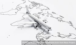 Plane model going over drawn map travel plane 0L7kgb
