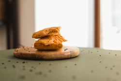 Flat bread sandwich on wooden cutting board
