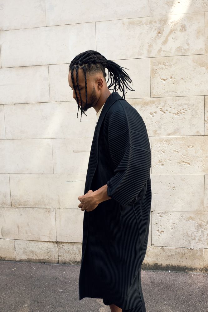 Trendy Black man posing on street