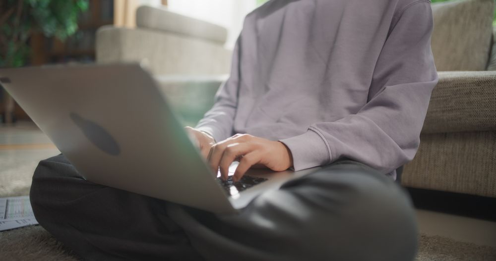 Close Up of a Male Working from Home, Using Laptop Computer to Optimize Performance and Achieve Goals