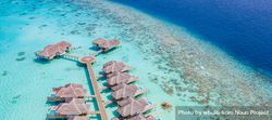 Two rows of overwater bungalows in the Maldives, wide shot 0Lqly5