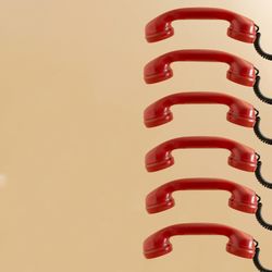 Six vintage red phone ear pieces
