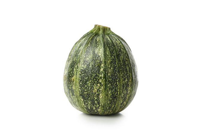 Fresh green zucchini isolated on blank background