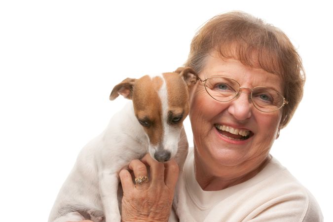 Happy Attractive Older Woman with Puppy.