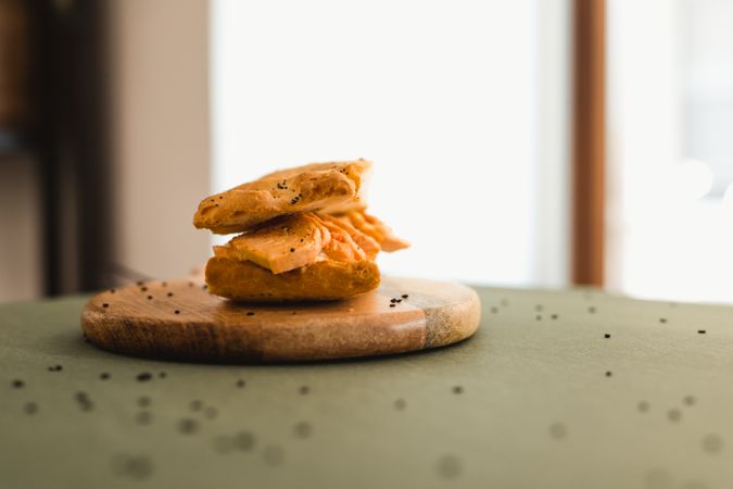 Flat bread sandwich on wooden cutting board