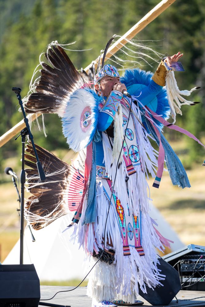 Montana, United States - August 17, 2022: Native man in full regalia performing, vertical