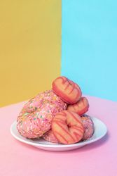 Pink doughnuts in a multicolor background