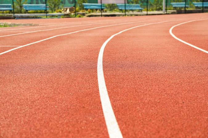 Red running track with lines outdoor, copy space
