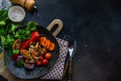 Top view of plate of grilled vegetable with copy space