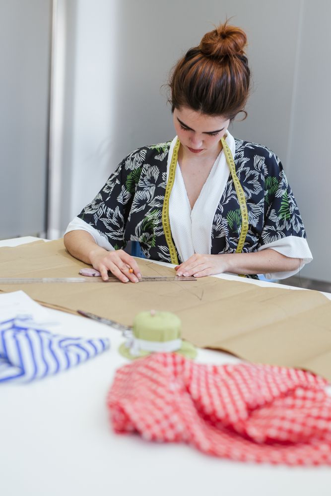 Woman in a sewing school
