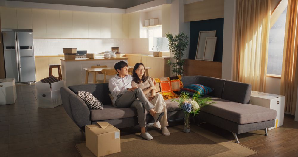 Family Home Moving in: Happy and Excited Young Korean Couple Enter Newly Purchased Apartment.