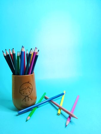 blue background with color pencil objects