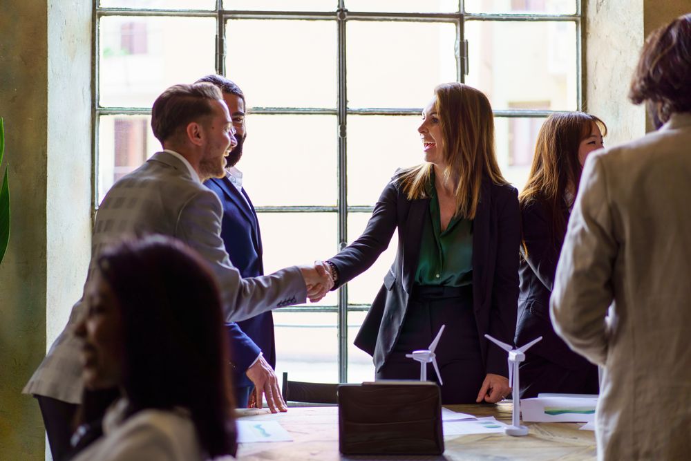 Business professionals greeting with a handshake