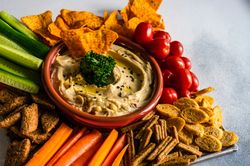 Traditional dish of hummus, fresh veggies and chips
