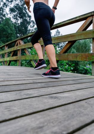 Woman running through an urban park