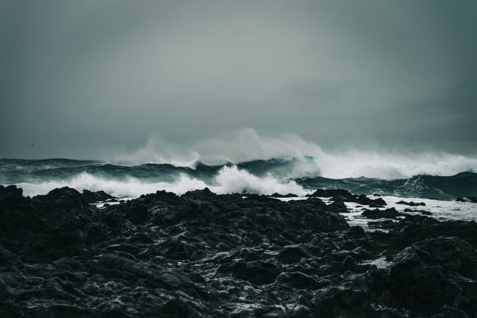 Waves of the Atlantic Ocean crashing into Iceland rugged coast
