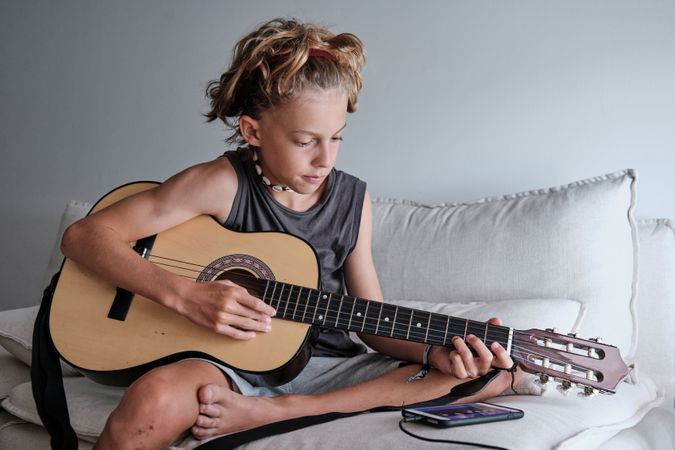 Child playing the guitar