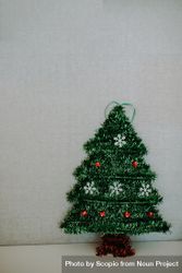 Mini Christmas tree on light background bY7L65