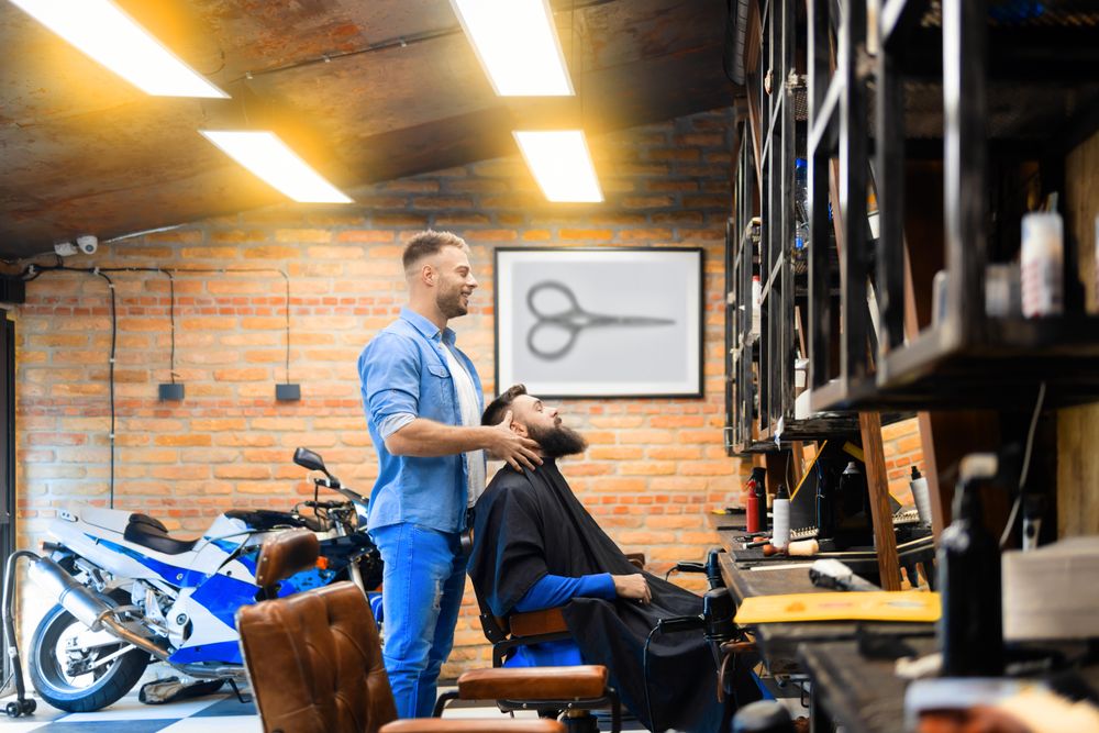 Barber talking to his bearded male client