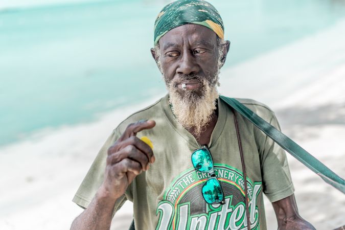 Jamaican man playing guitar