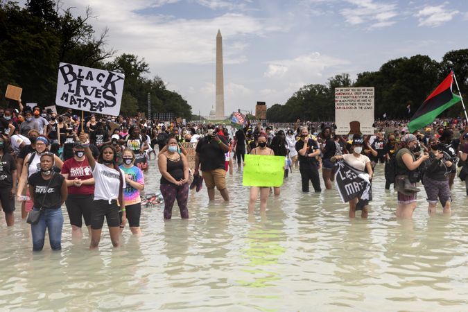Large group of BLM protestors in Reflecting Pool, Washington, D.C.