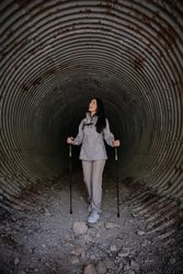 Active Hispanic woman in old tunnel