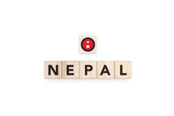 Wooden blocks bearing the name and flag of Nepal.