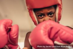 Girl in boxing gear during a boxing fight bYPrg4