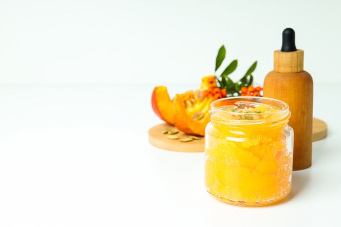 Skin care and face care concept - pumpkin cosmetic