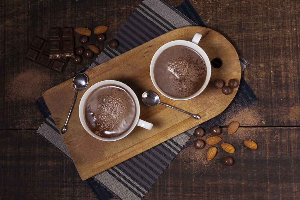 Top view of hot chocolate and almonds