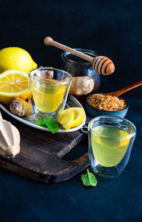 Yellow detox drinks with ginger, lemon and honey