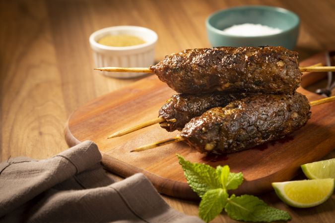 Beef kafta on the wooden board. Kafta, Traditional Arabic cuisine.