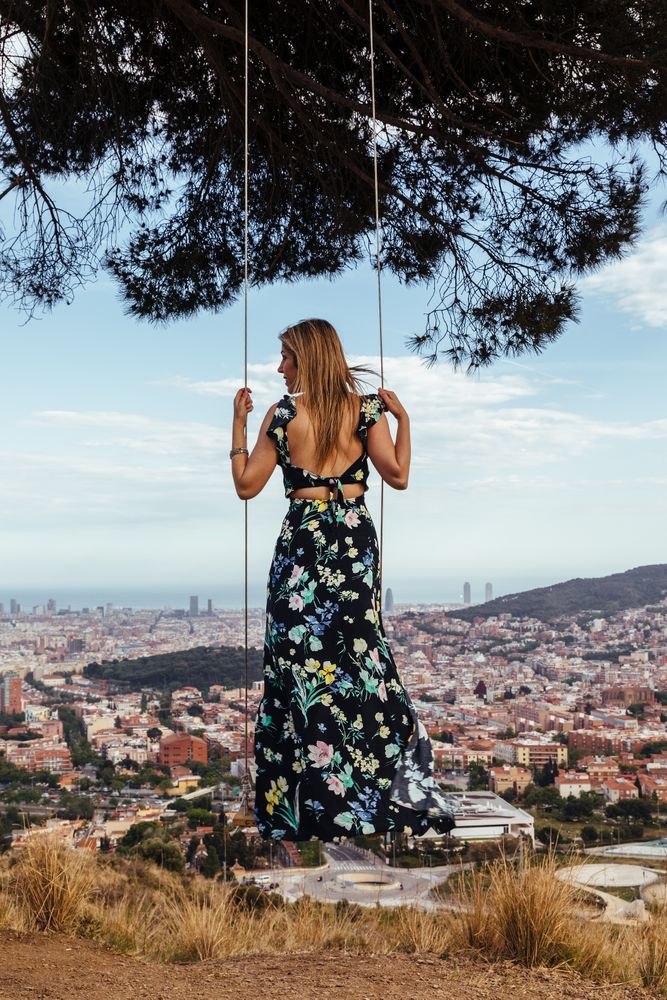 Female from behind on a swing