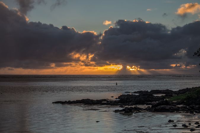 Indian Ocean in the morning with sun peaking through the clouds