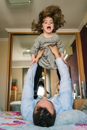 Father playing with daughter